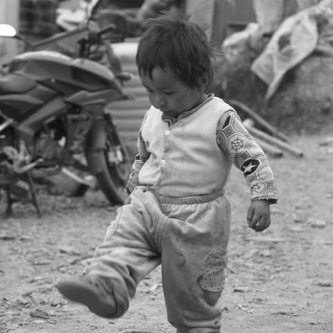 A village child finds joy in play